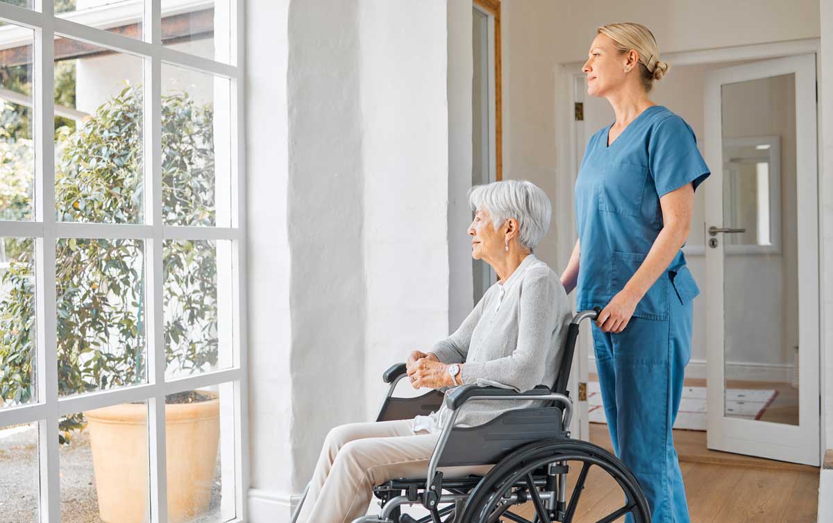 shot-of-a-nurse-caring-for-a-senior-woman-in-a-wheelchair